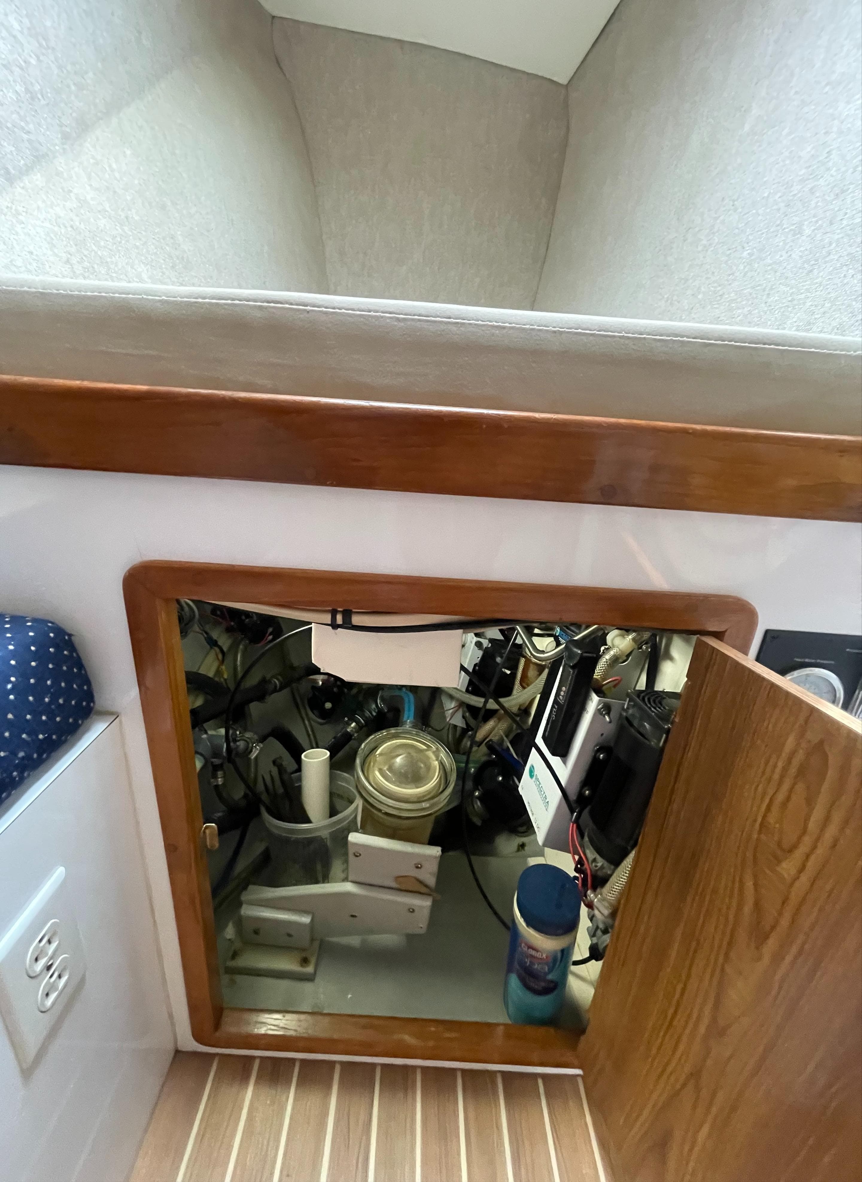 Spectra Watermaker under Starboard forward berth in Guest Cabin