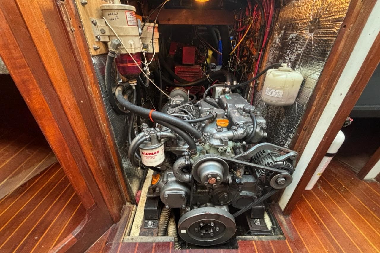 Engine room of a 1989 Caliber 38 sailboat, featuring a Yanmar engine.