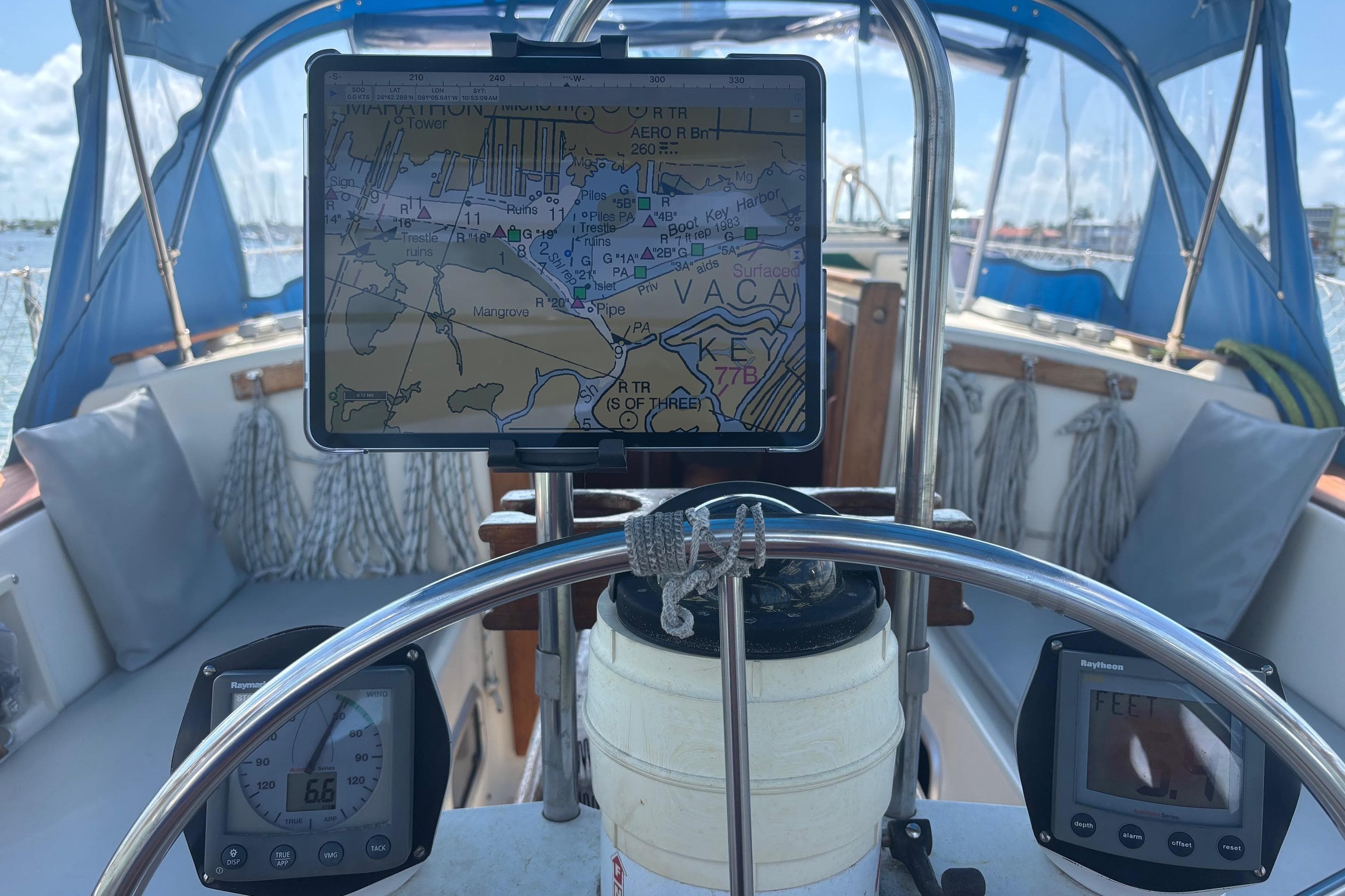 Sailboat cockpit with navigation equipment, Caliber 38, 1989 model, featuring a digital map display.