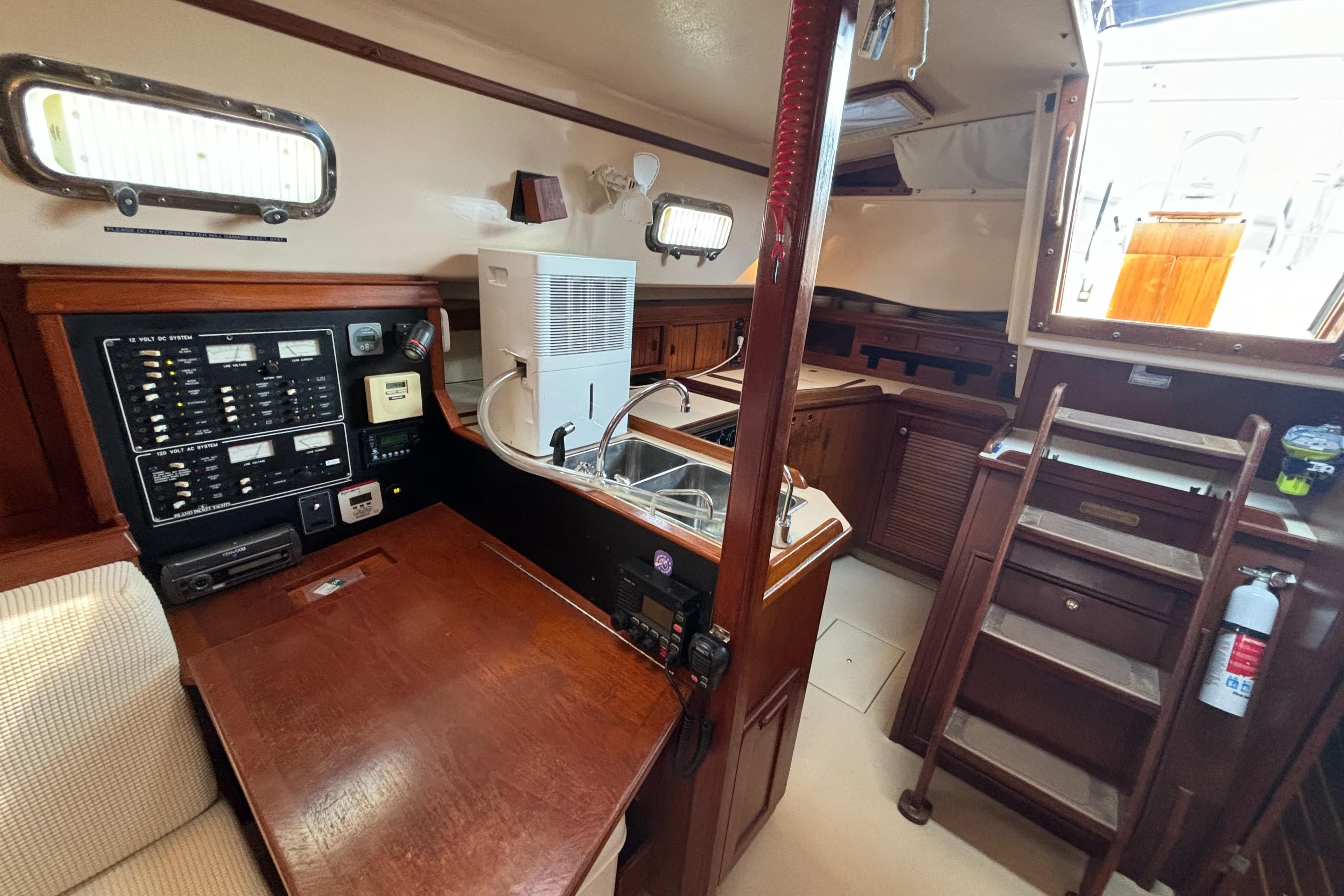 Interior of 1995 Island Packet 40 sailboat with navigation station and galley.