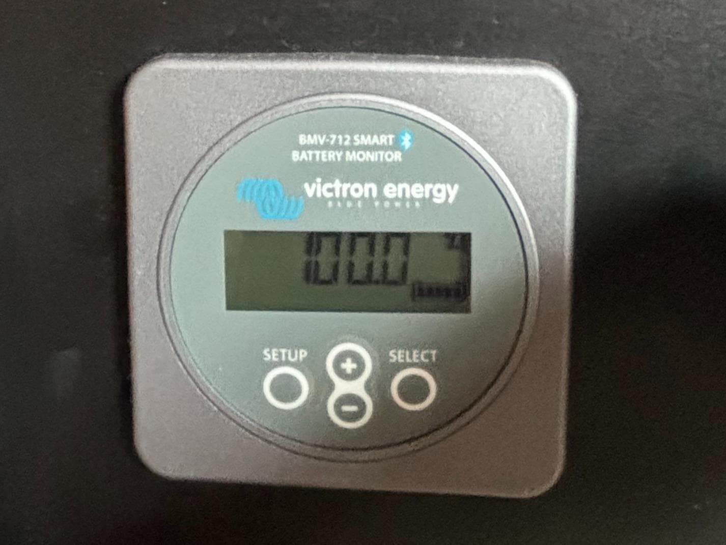 Battery monitor display from a 1995 Island Packet 40, showing Victron Energy BMV-712 Smart.