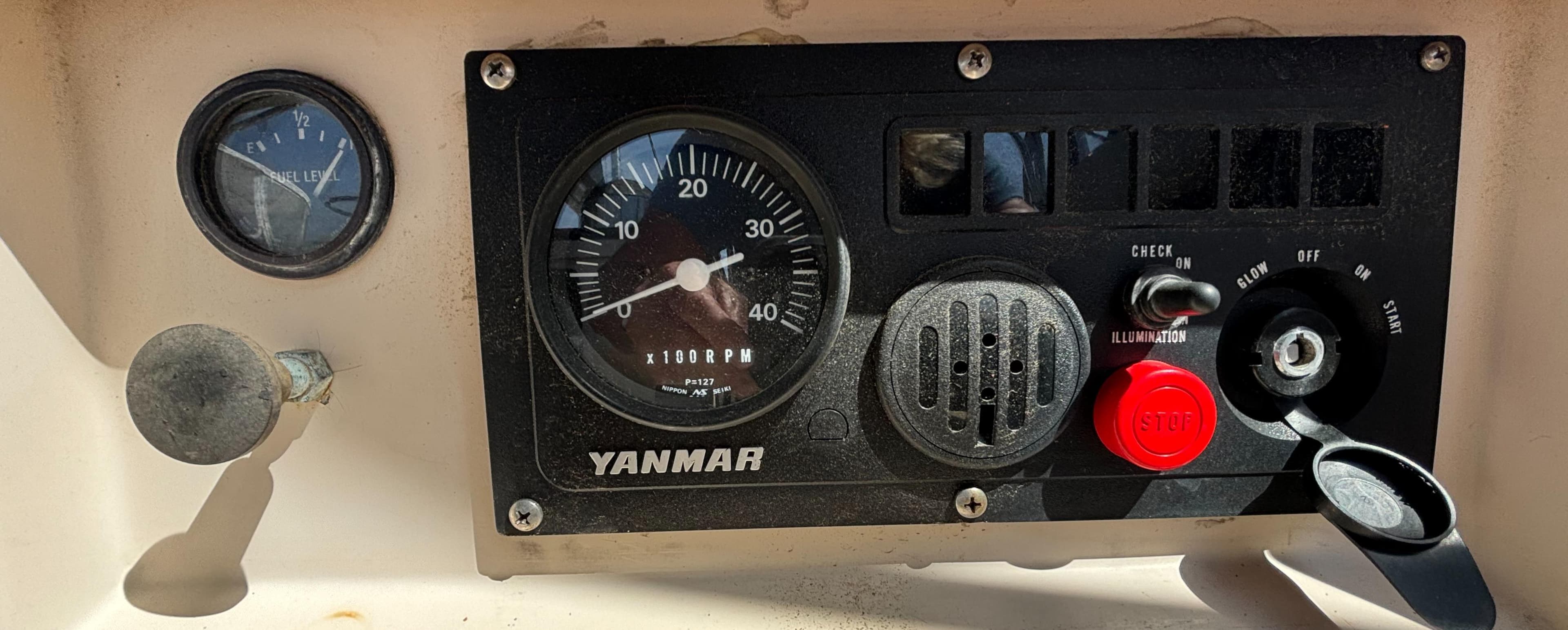 Control panel of a 1995 Island Packet 40 sailboat with Yanmar engine gauges.