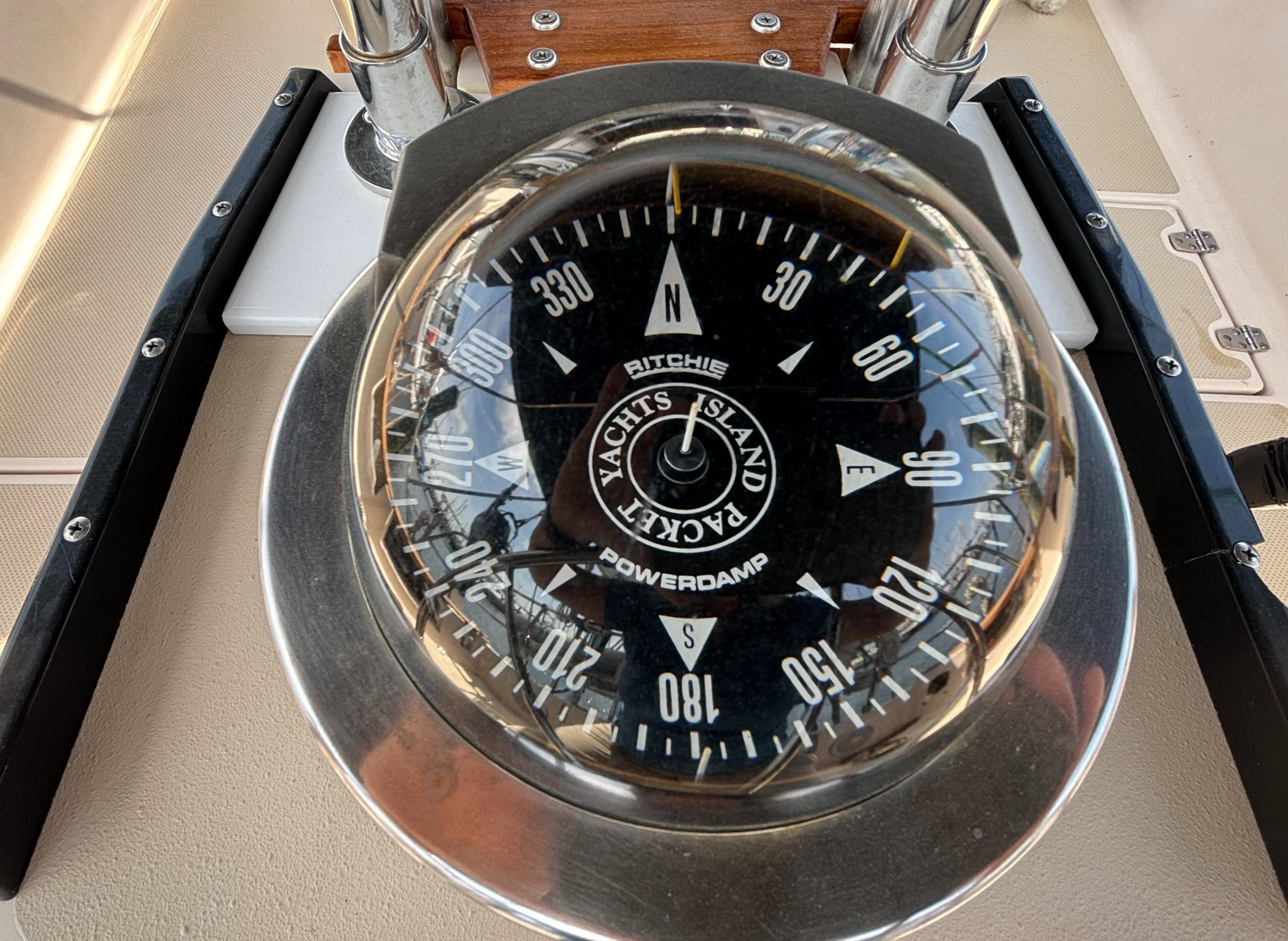 Compass on 1995 Island Packet 40 yacht, displaying cardinal directions.