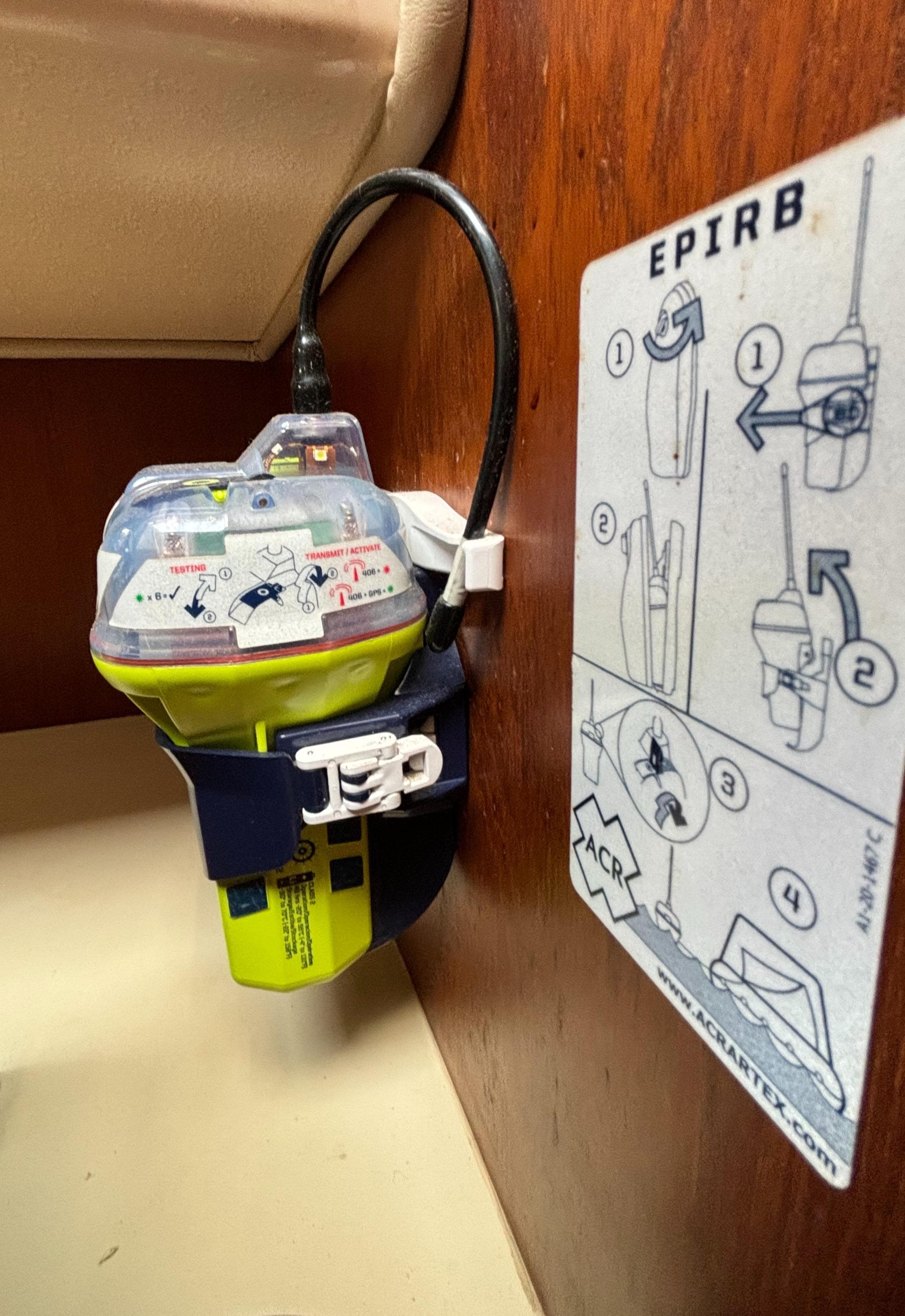 EPIRB device on 1995 Island Packet 40 sailboat with usage instructions.