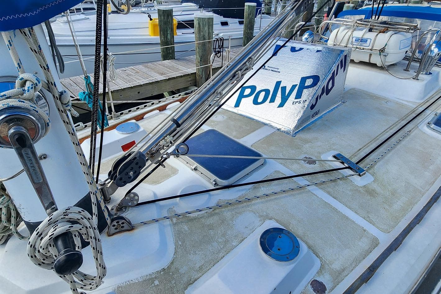 Deck of 1980 Nordic 44 sailboat with ropes and PolyP insulation.
