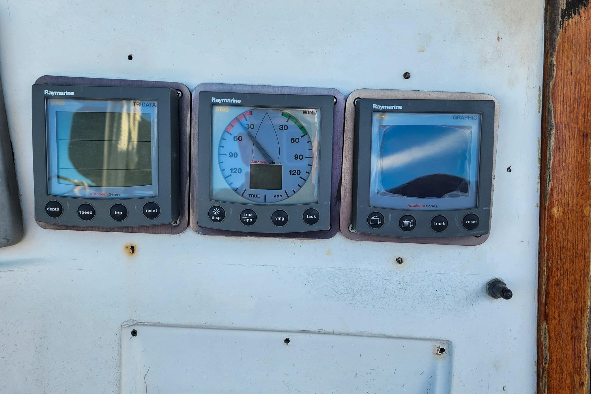 Raymarine navigation instruments on a 1980 Nordic 44 sailboat dashboard.