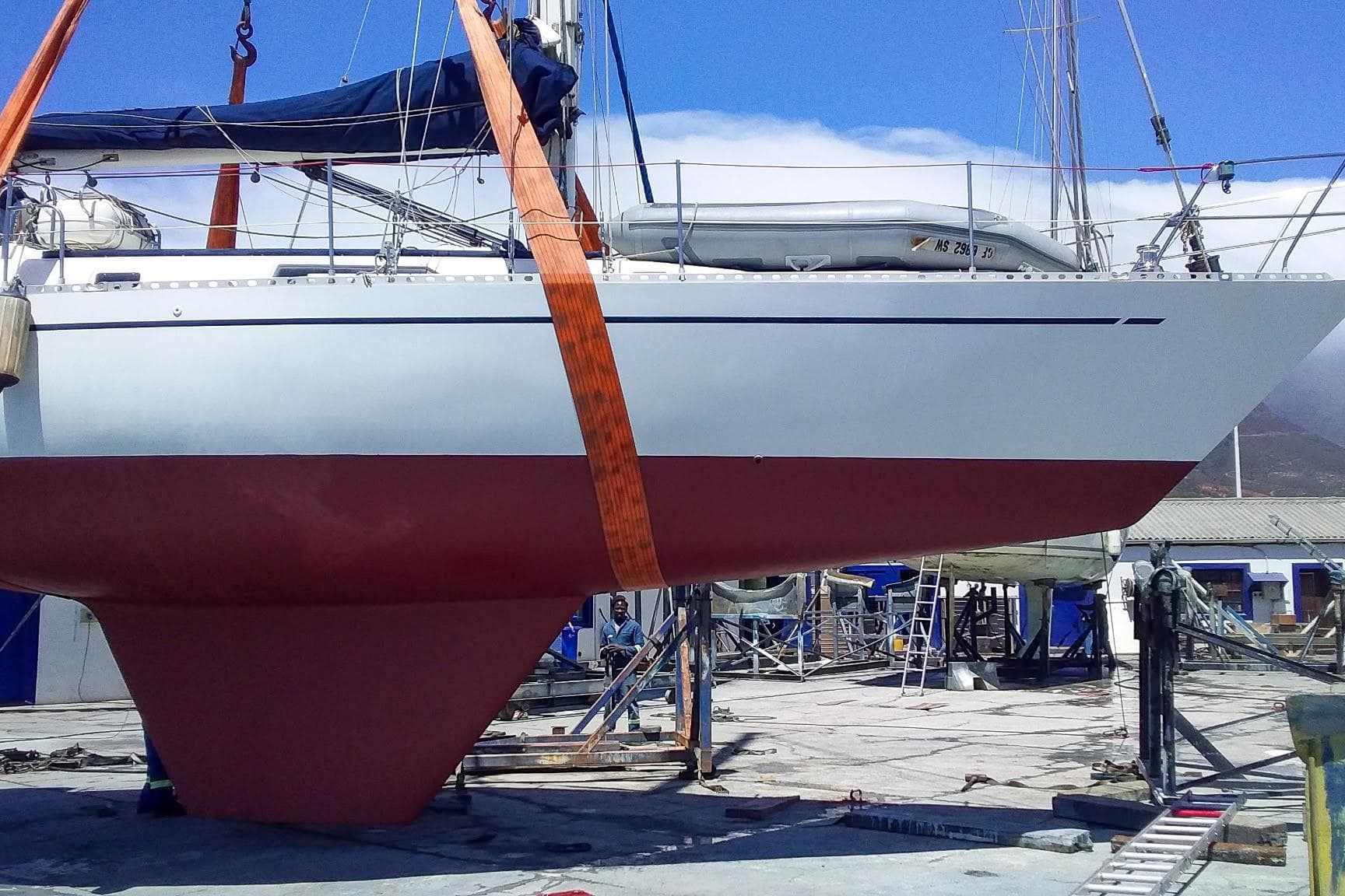 Sailboat Nordic 44 from 1980 in dry dock, showcasing its hull and keel.