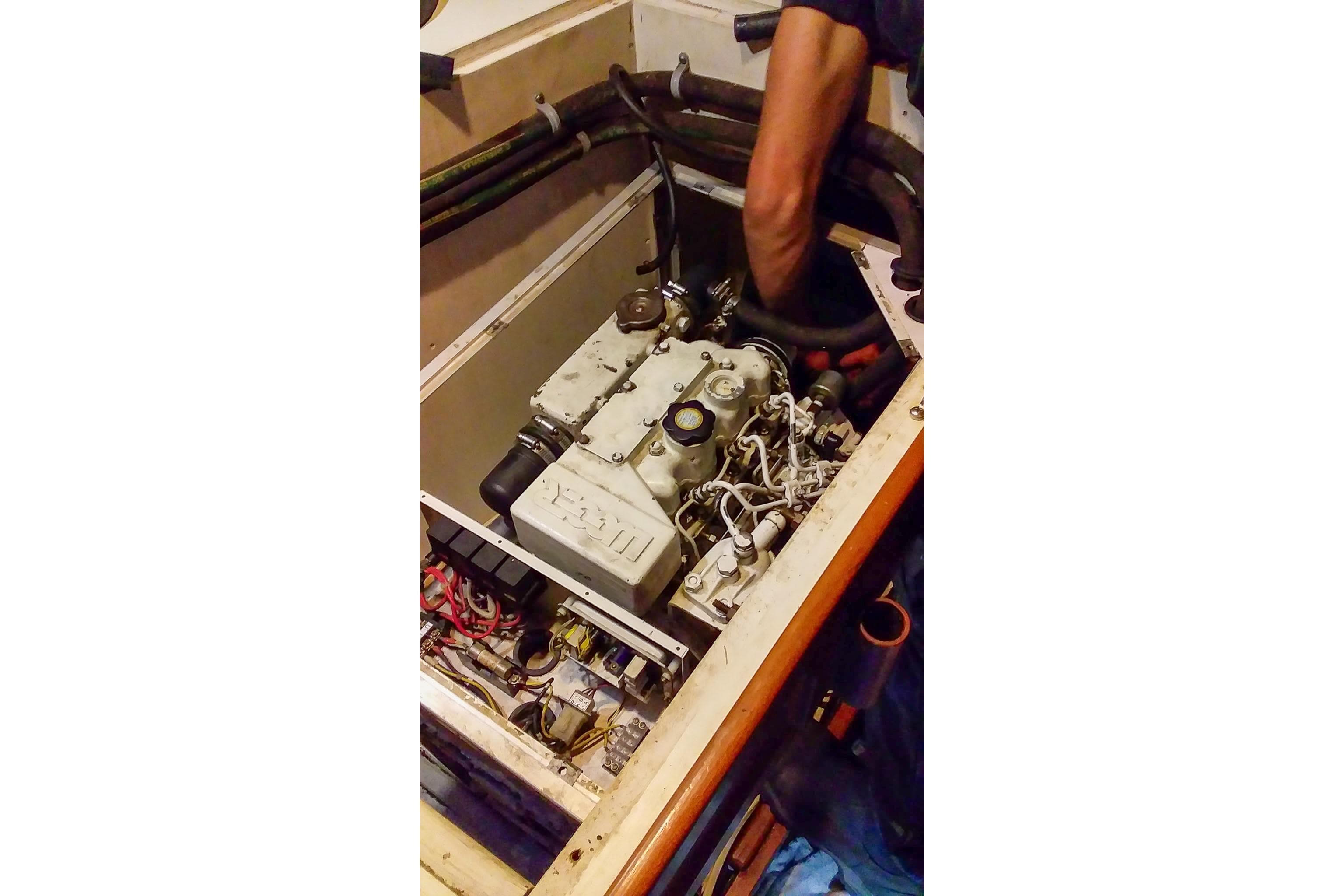 Engine maintenance on a 1980 Nordic 44 sailboat, showcasing detailed mechanical components.