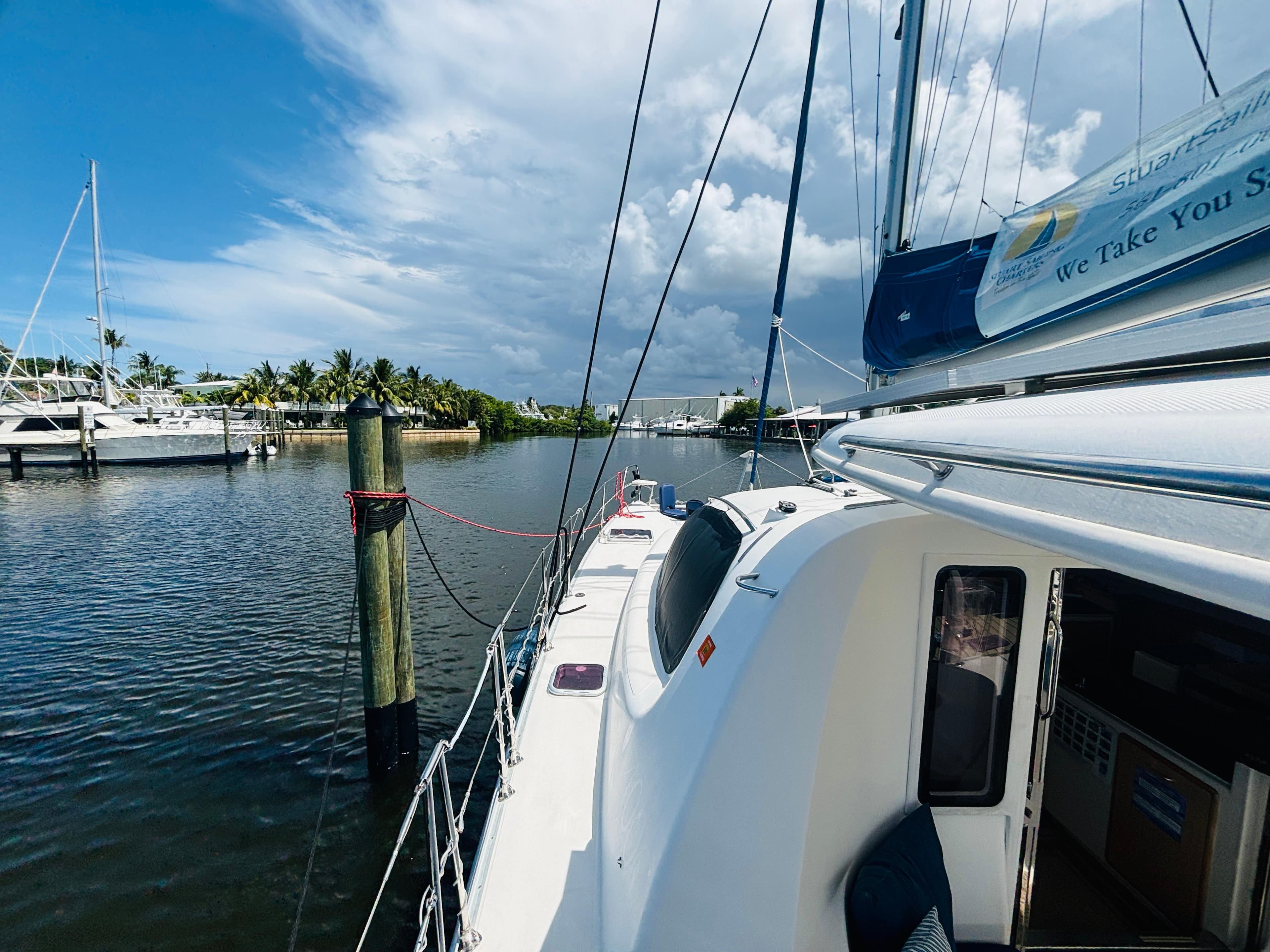 Sailing catamaran Leopard 40 docked in a serene marina, 2006 model.