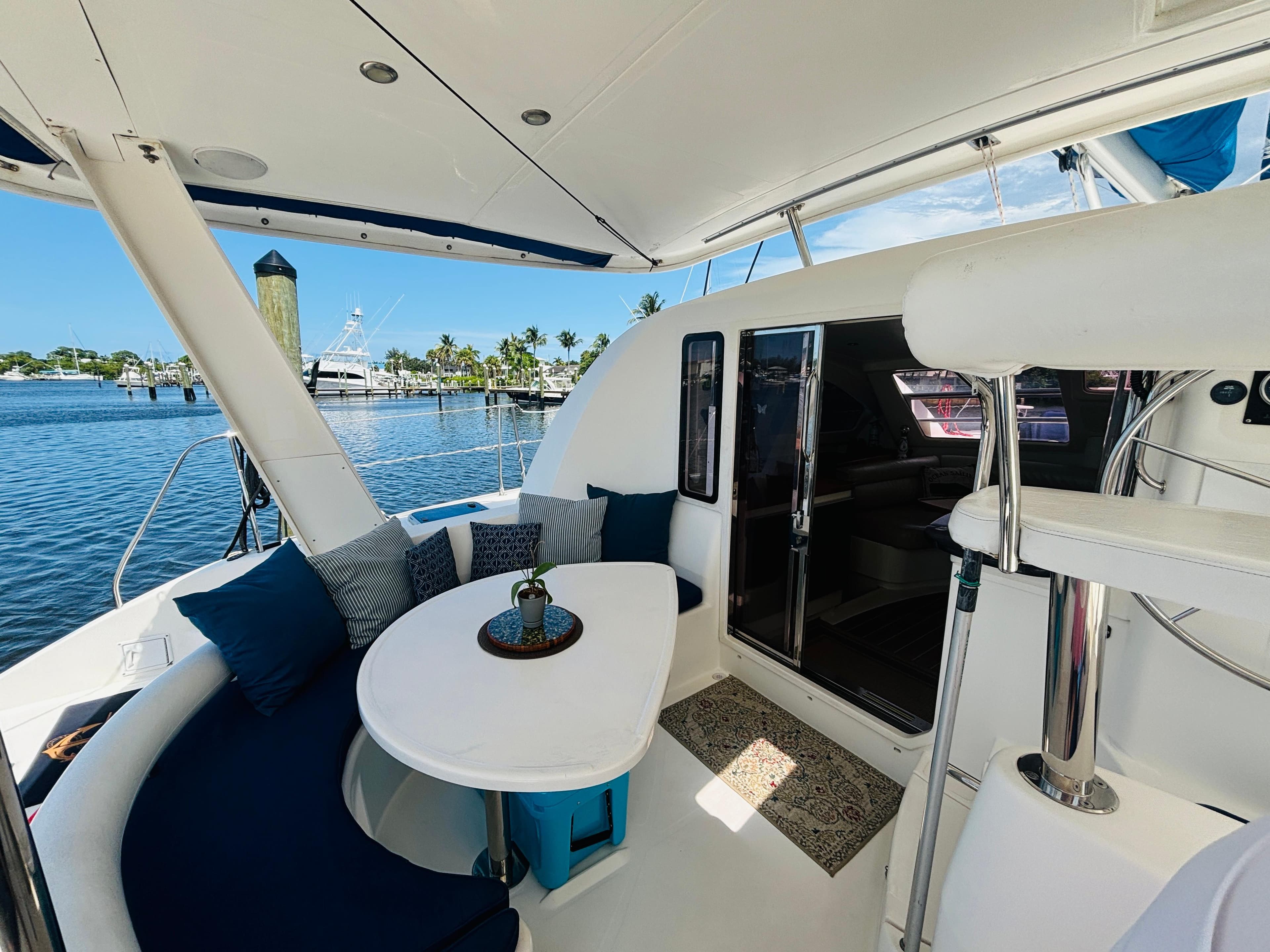 Luxurious 2006 Leopard 40 catamaran interior with seating area and ocean view.