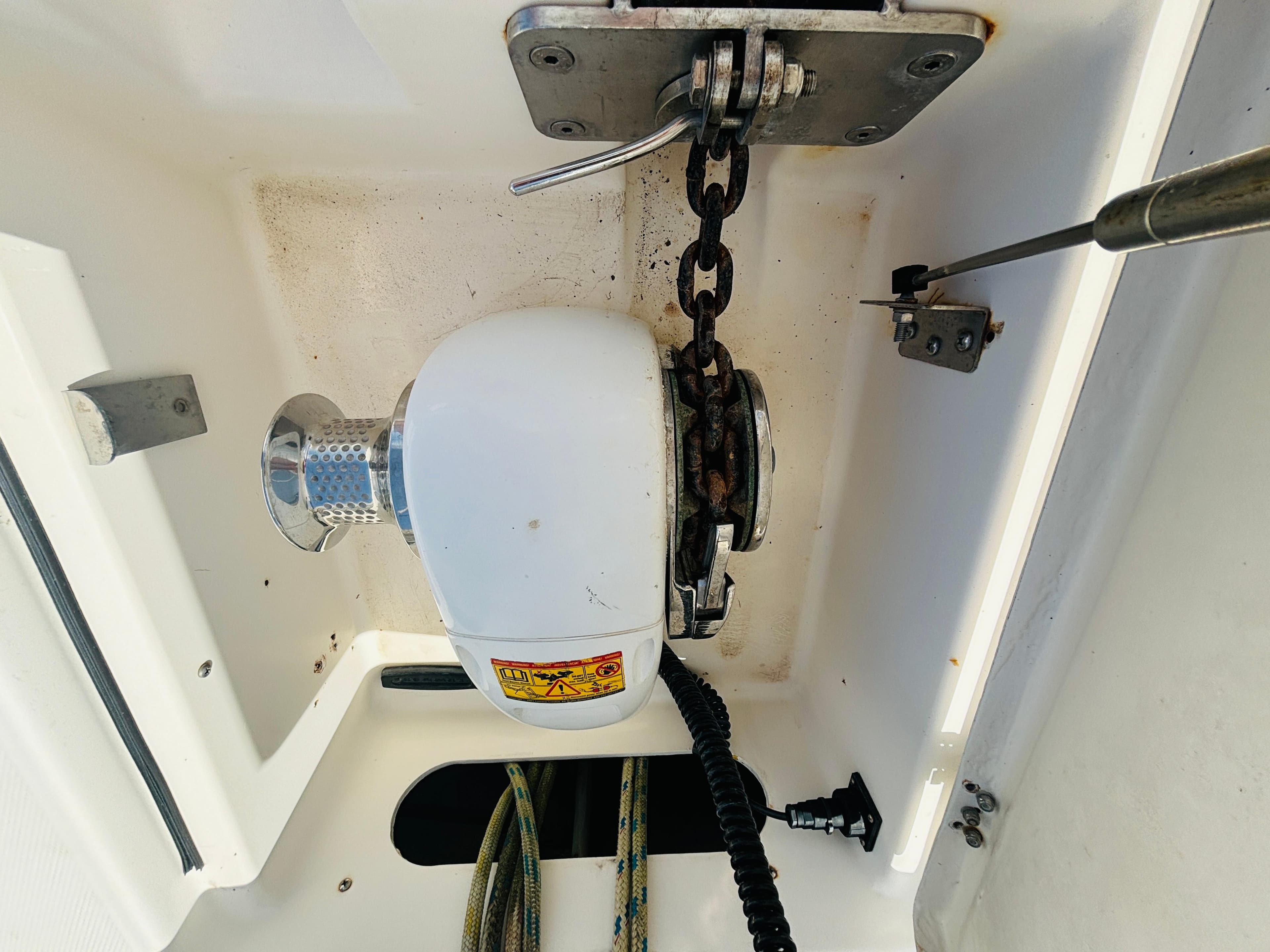 Anchor windlass system on a 2006 Leopard 40 yacht, featuring chain and rope storage.