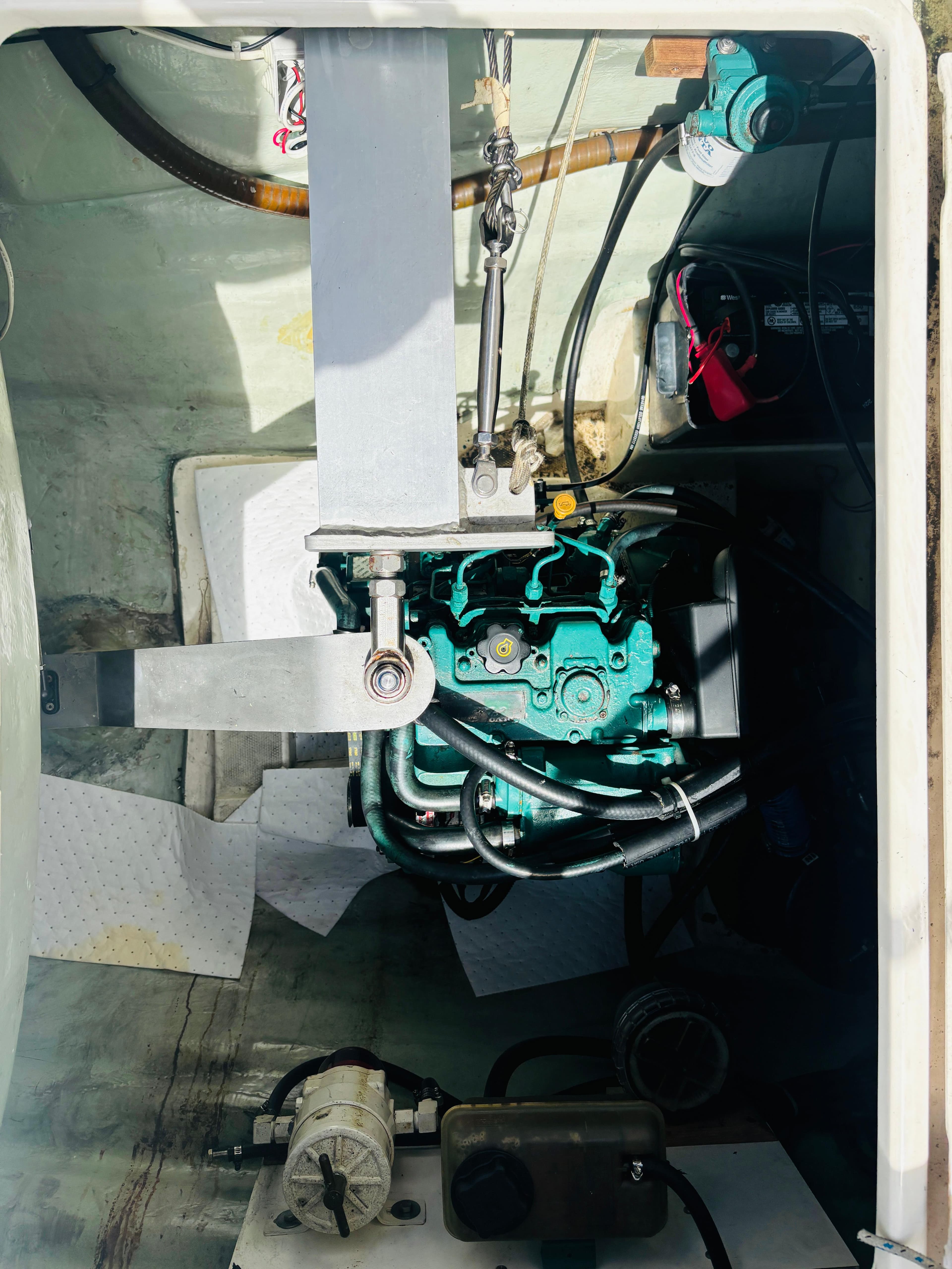 Engine compartment of a 2006 Leopard 40 catamaran, showing mechanical components and wiring.