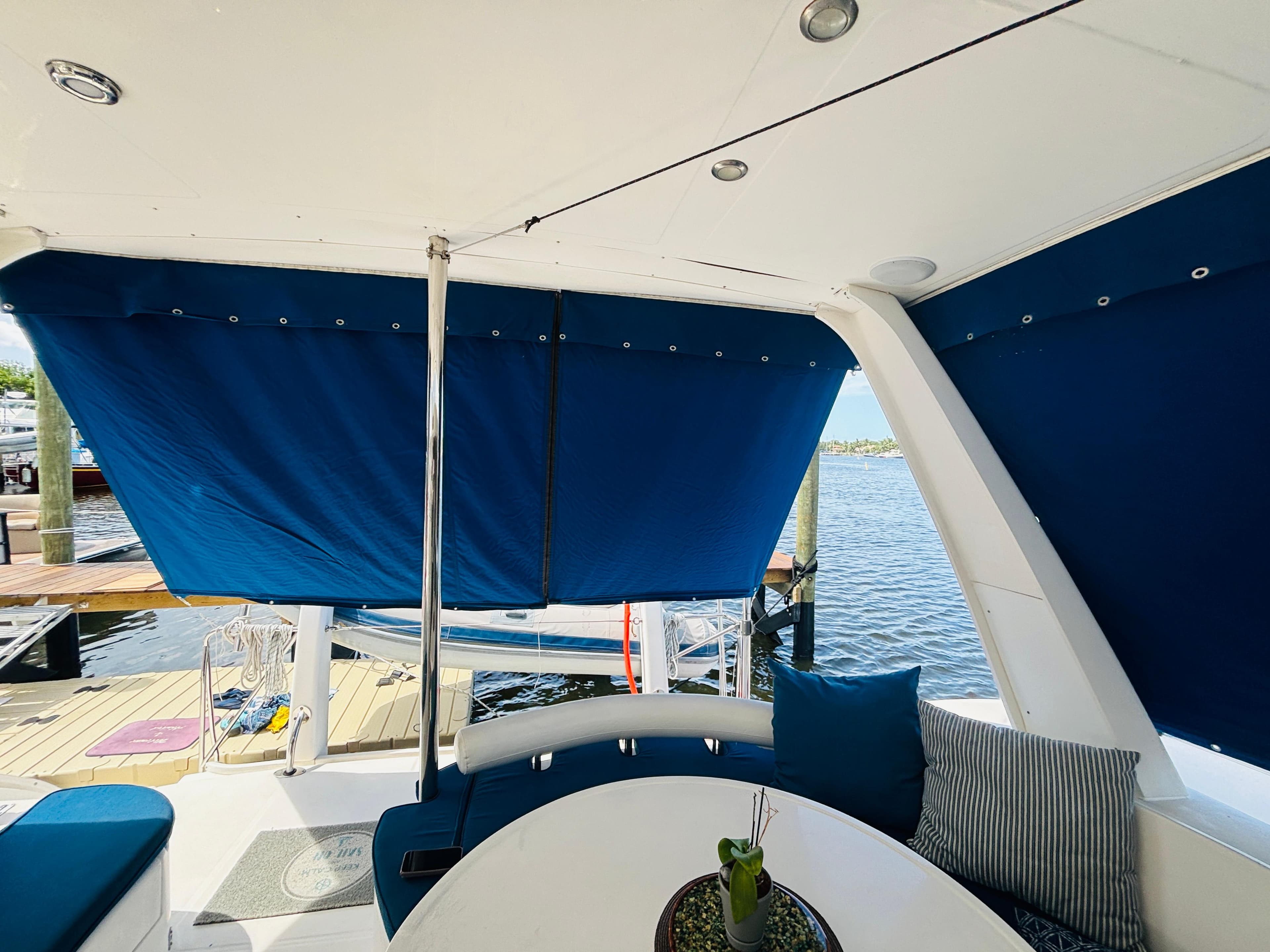 2006 Leopard 40 yacht interior with blue sunshades and waterfront view.
