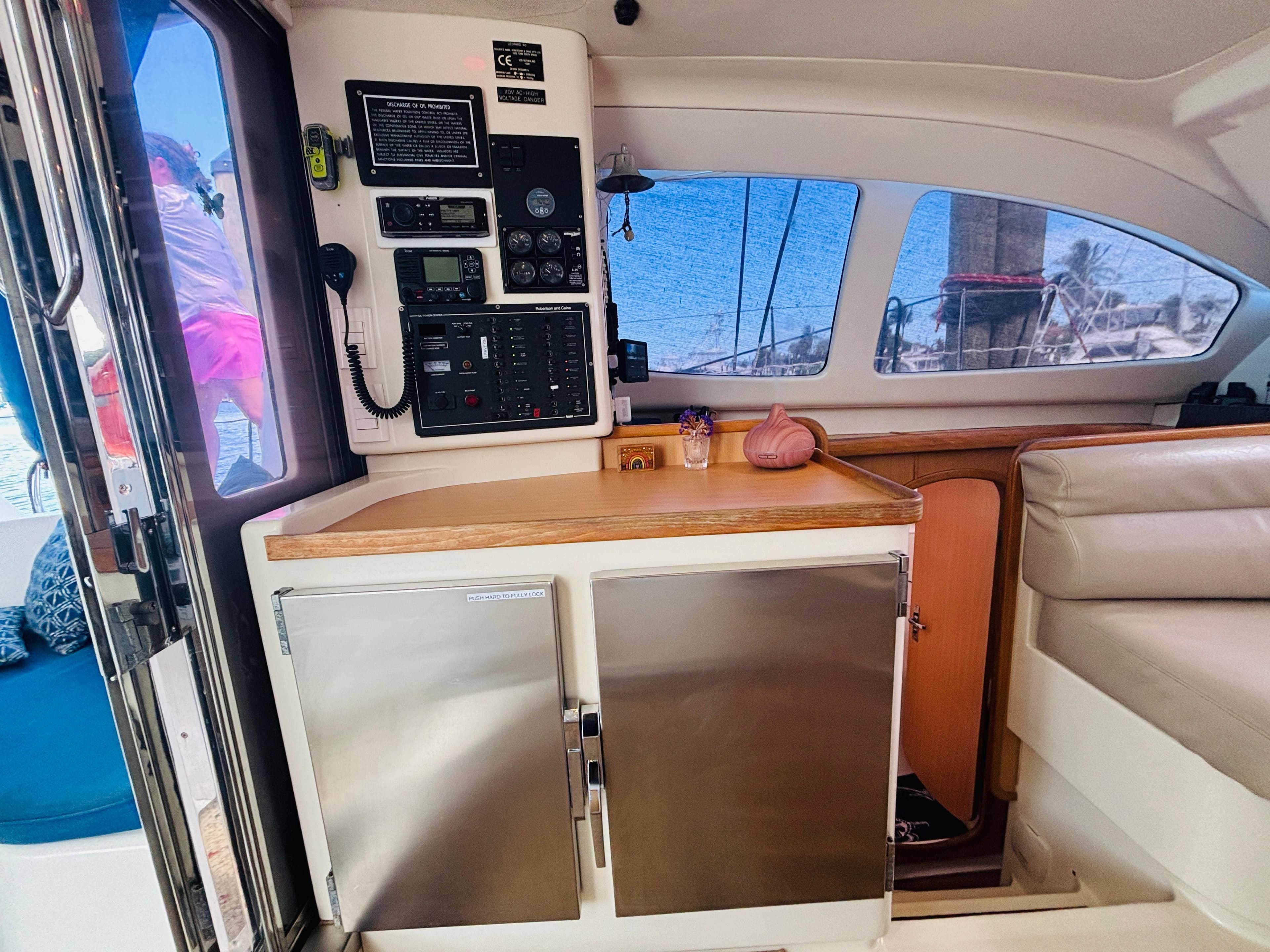 Interior of a 2006 Leopard 40 catamaran with navigation panel and seating area.
