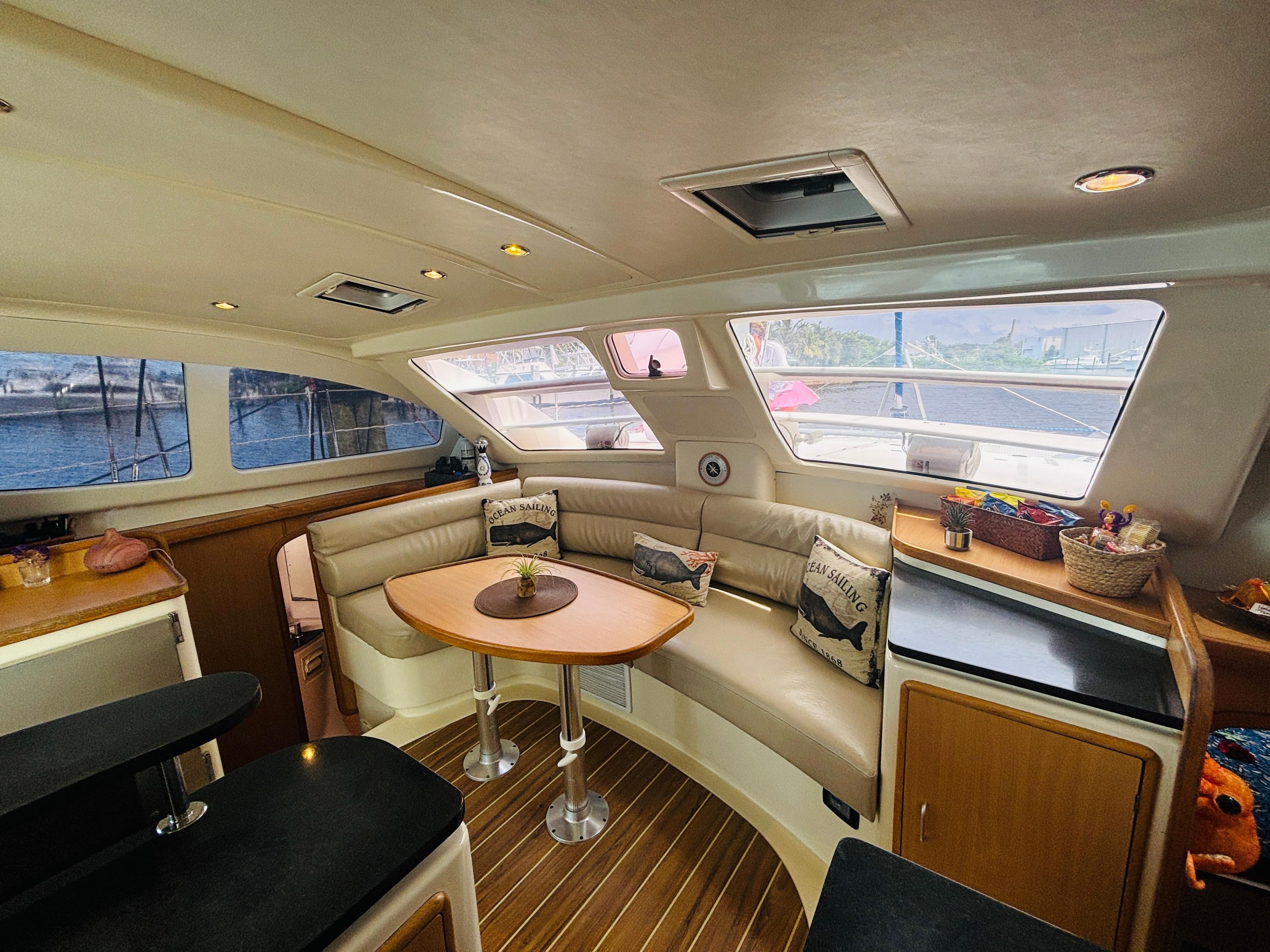 Luxurious interior of a 2006 Leopard 40 yacht with comfortable seating and elegant decor.